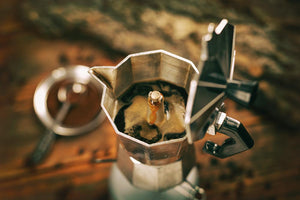 A stove top coffee boiling