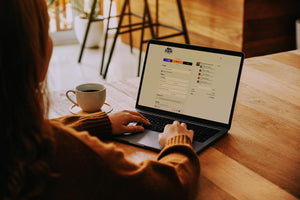 Deadline Coffee checkout page on a woman's laptop in a coffee shop